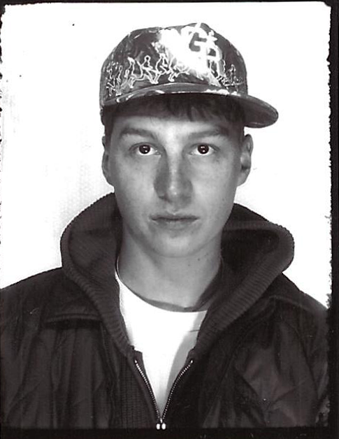 Black and white portrait of Max Kinsella wearing a cap
